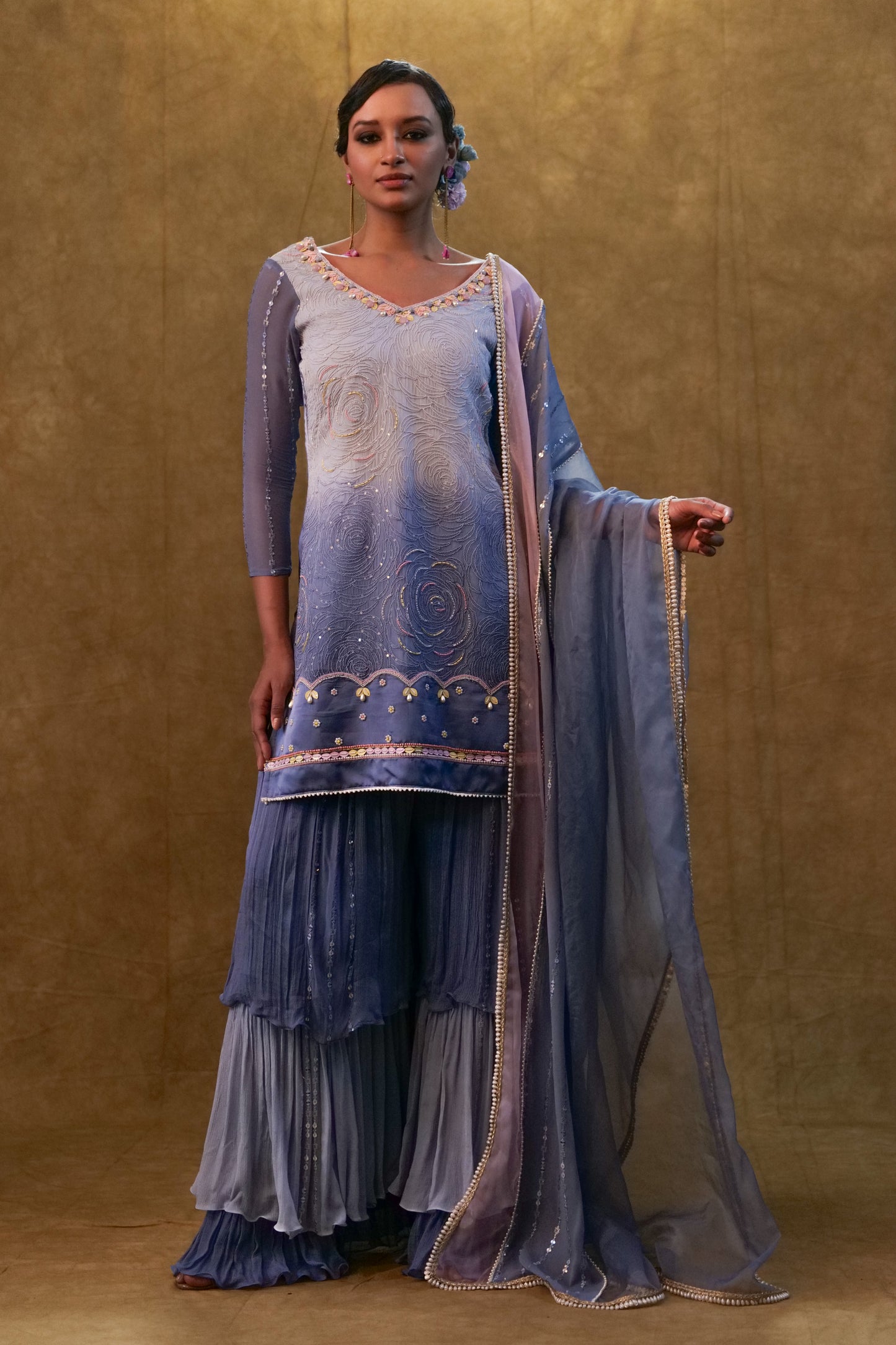 Ice blue shaded kurta set paired with dupatta and layered color block sharara