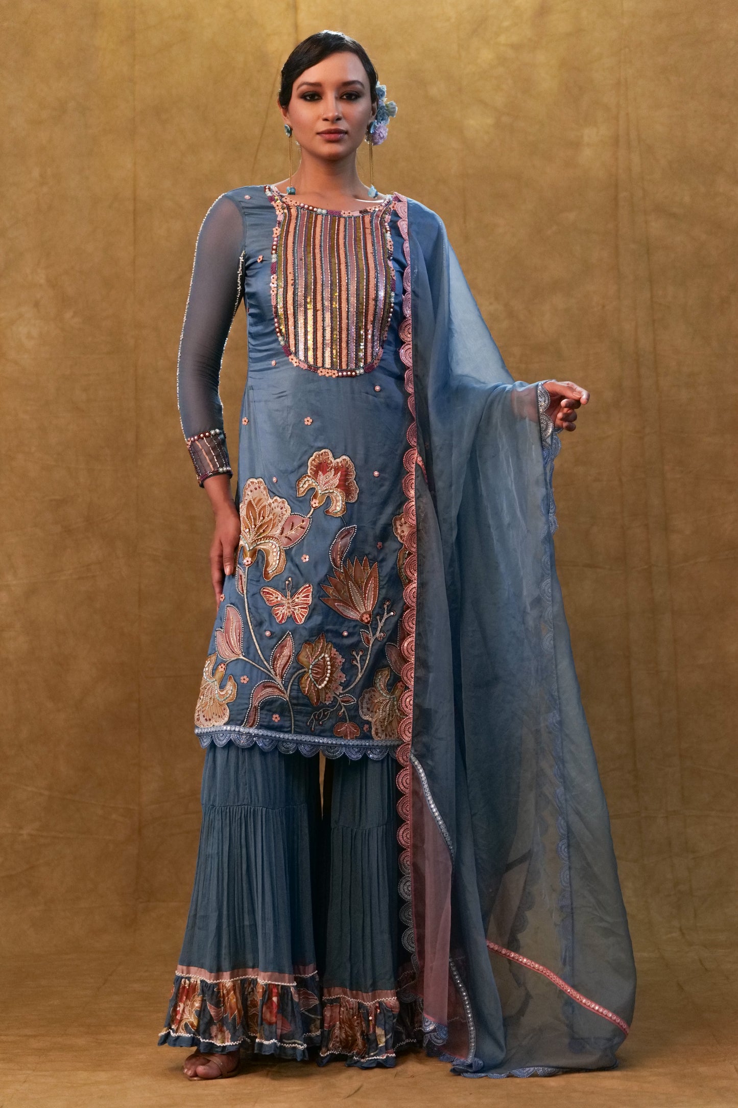 Blue applique work kurta set paired with flared sharara and a Dupatta