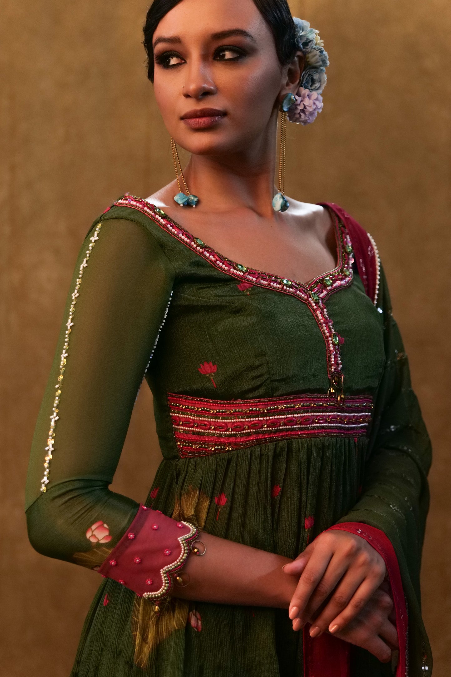 Green printed sharara set paired with color block dupatta and a peplum