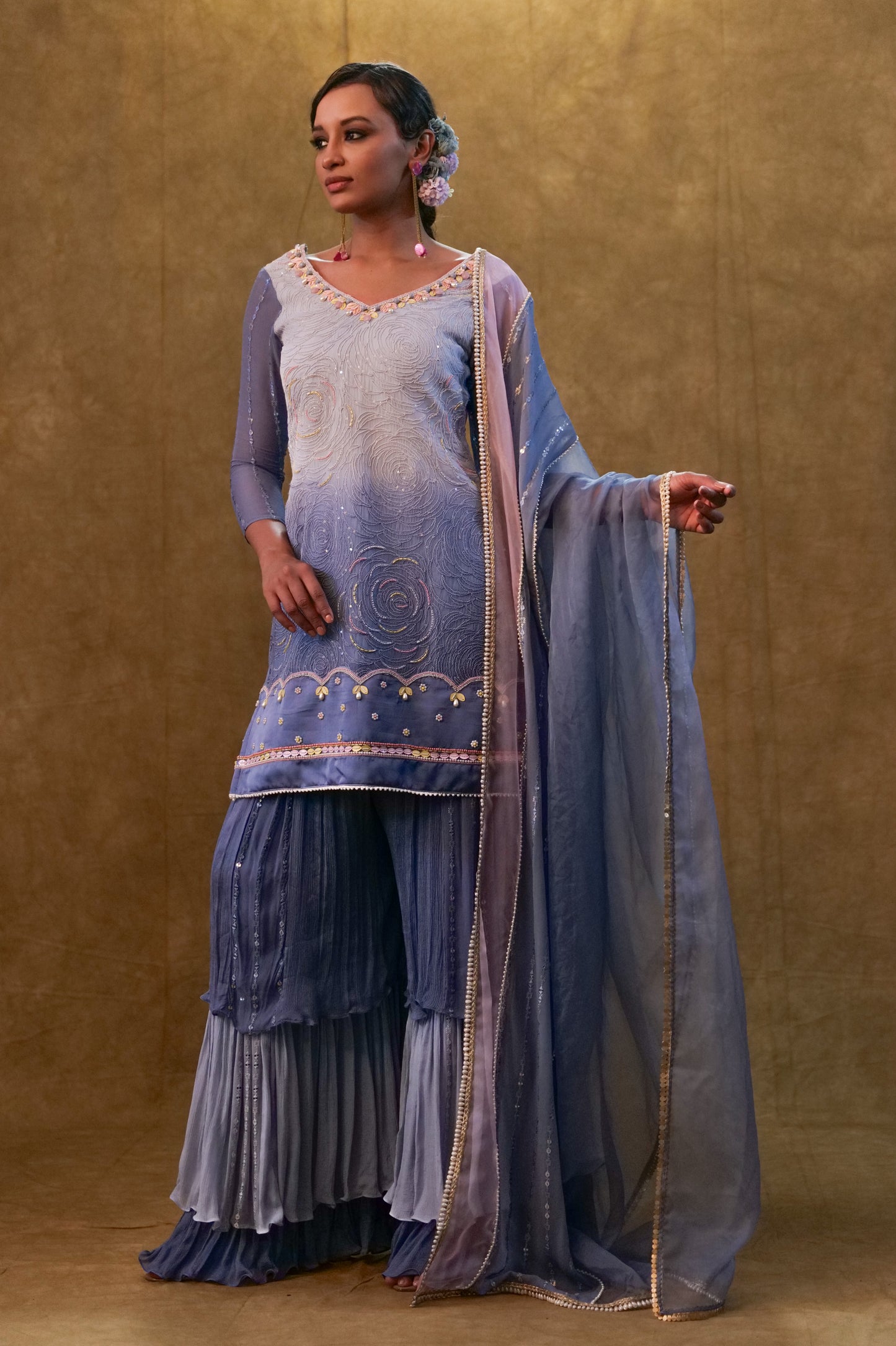 Ice blue shaded kurta set paired with dupatta and layered color block sharara
