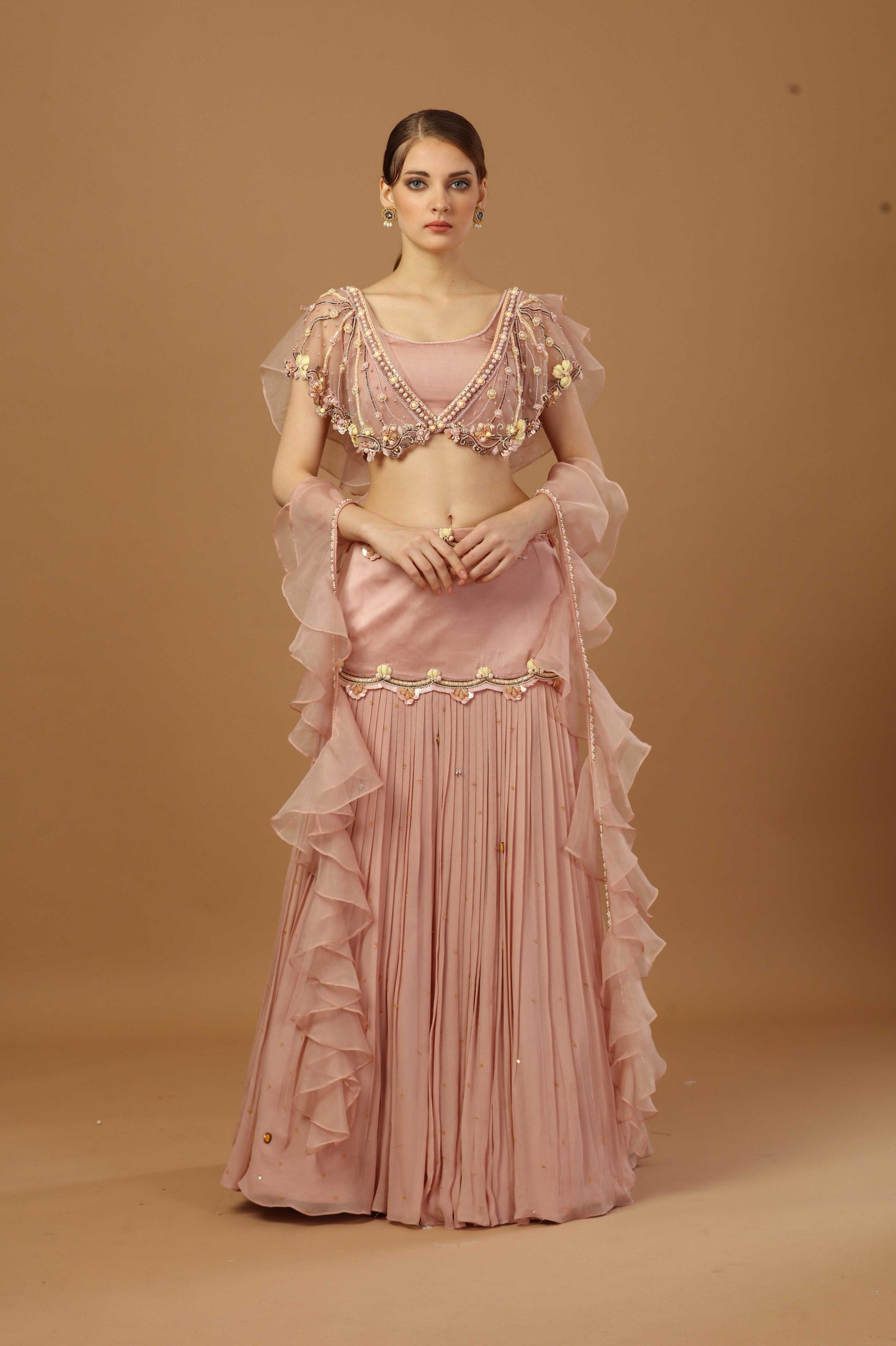 Pleated skirt with layered blouse and a ruffle dupatta