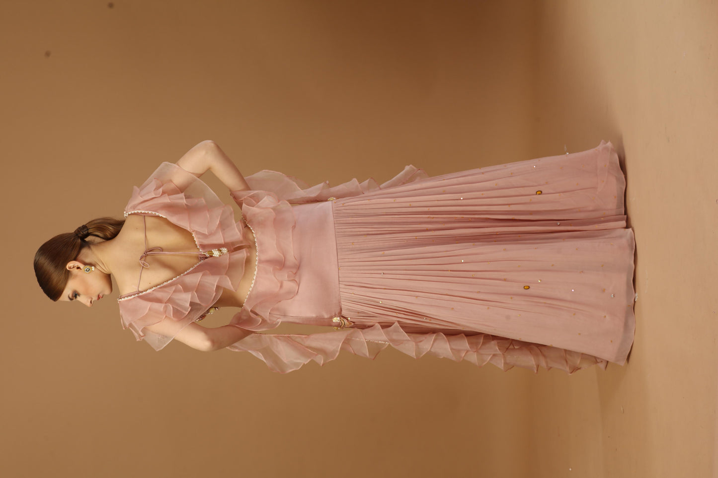 Pleated skirt with layered blouse and a ruffle dupatta