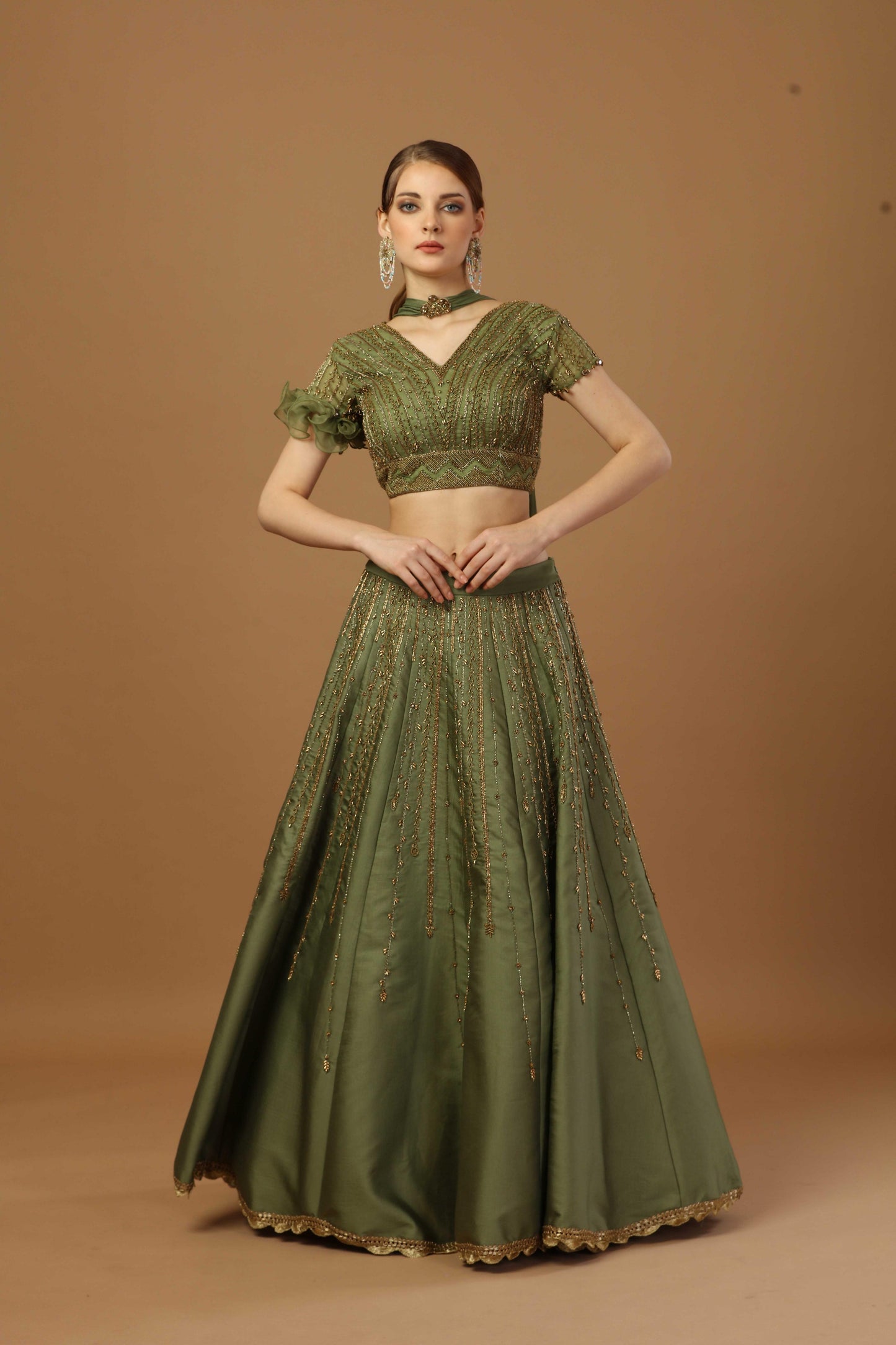 Blouse with one sided ruffle sleeve ,comes with lehenga and a narrow neck dupatta