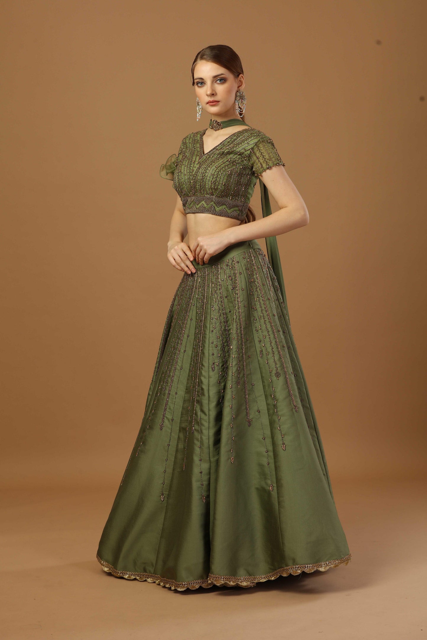 Blouse with one sided ruffle sleeve ,comes with lehenga and a narrow neck dupatta