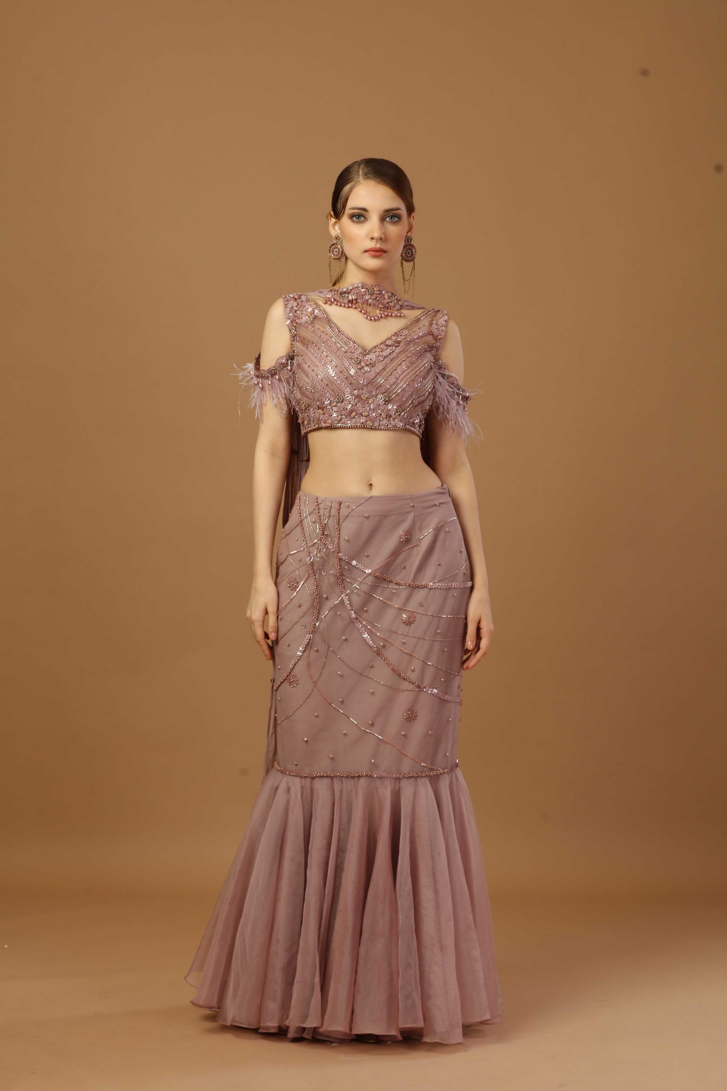 Fish cut skirt with matching tonal blouse and a narrow neck dupatta.