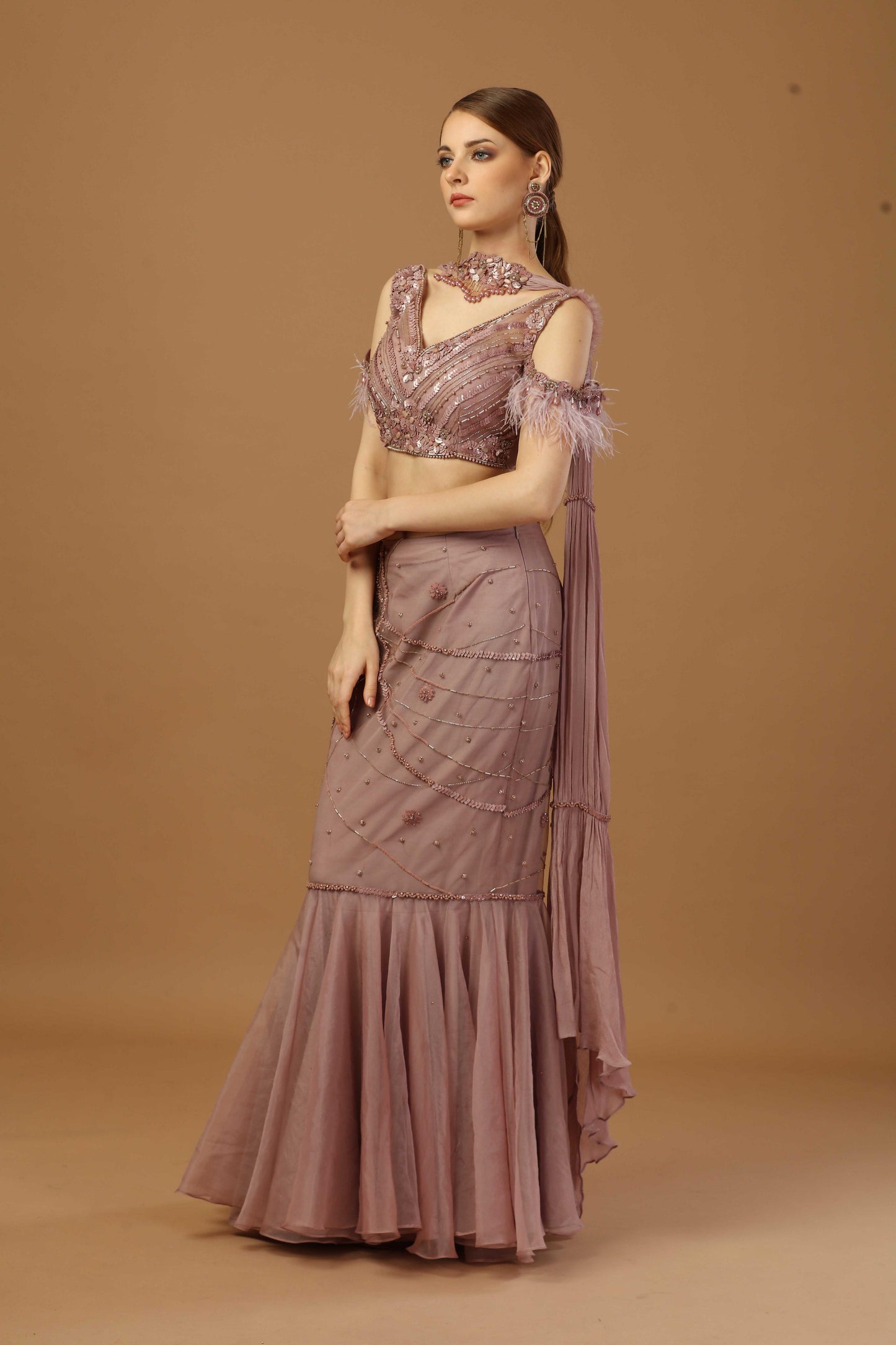 Fish cut skirt with matching tonal blouse and a narrow neck dupatta.