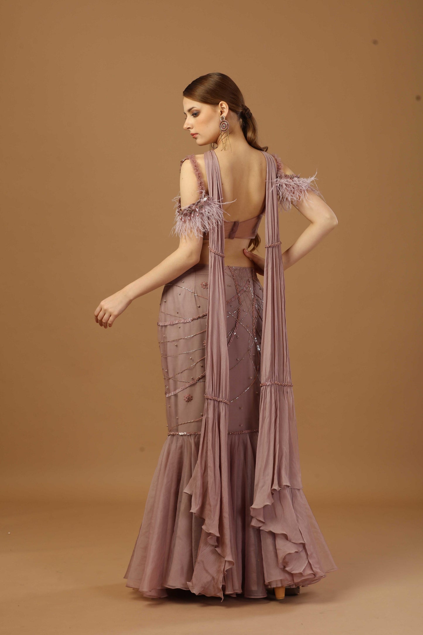Fish cut skirt with matching tonal blouse and a narrow neck dupatta.