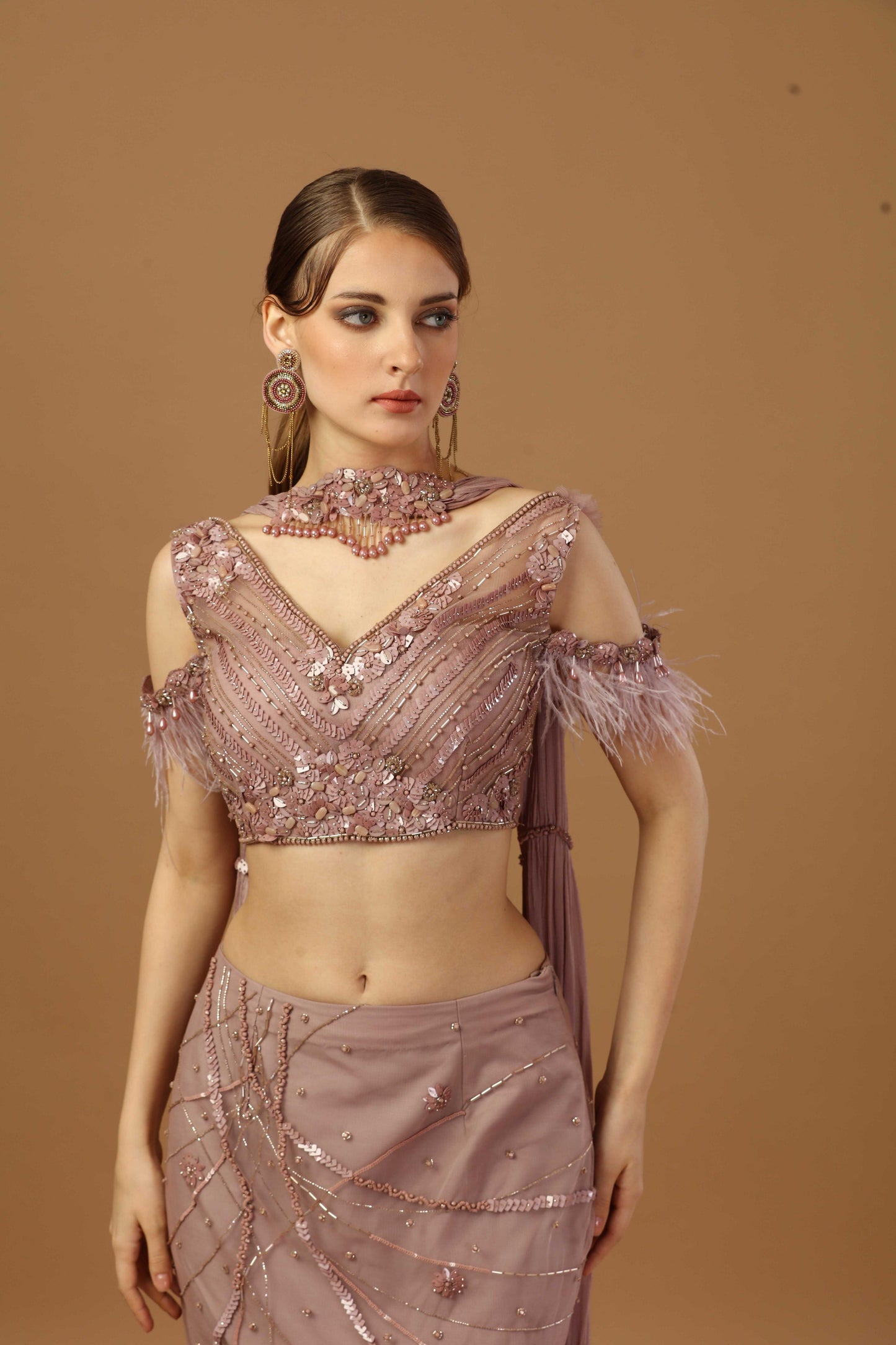 Fish cut skirt with matching tonal blouse and a narrow neck dupatta.