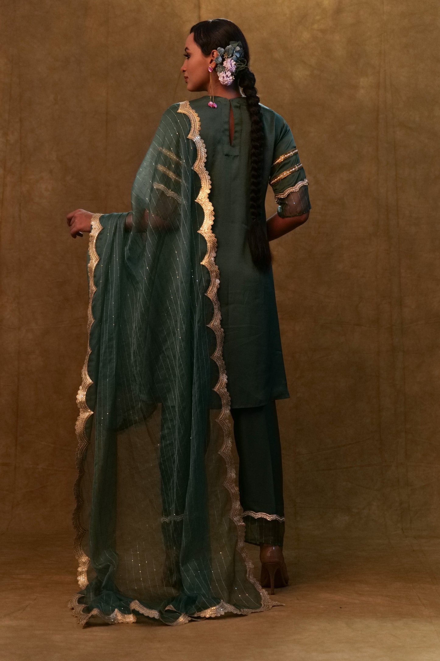 Emerald green kurta set paired with pants and organza dupatta
