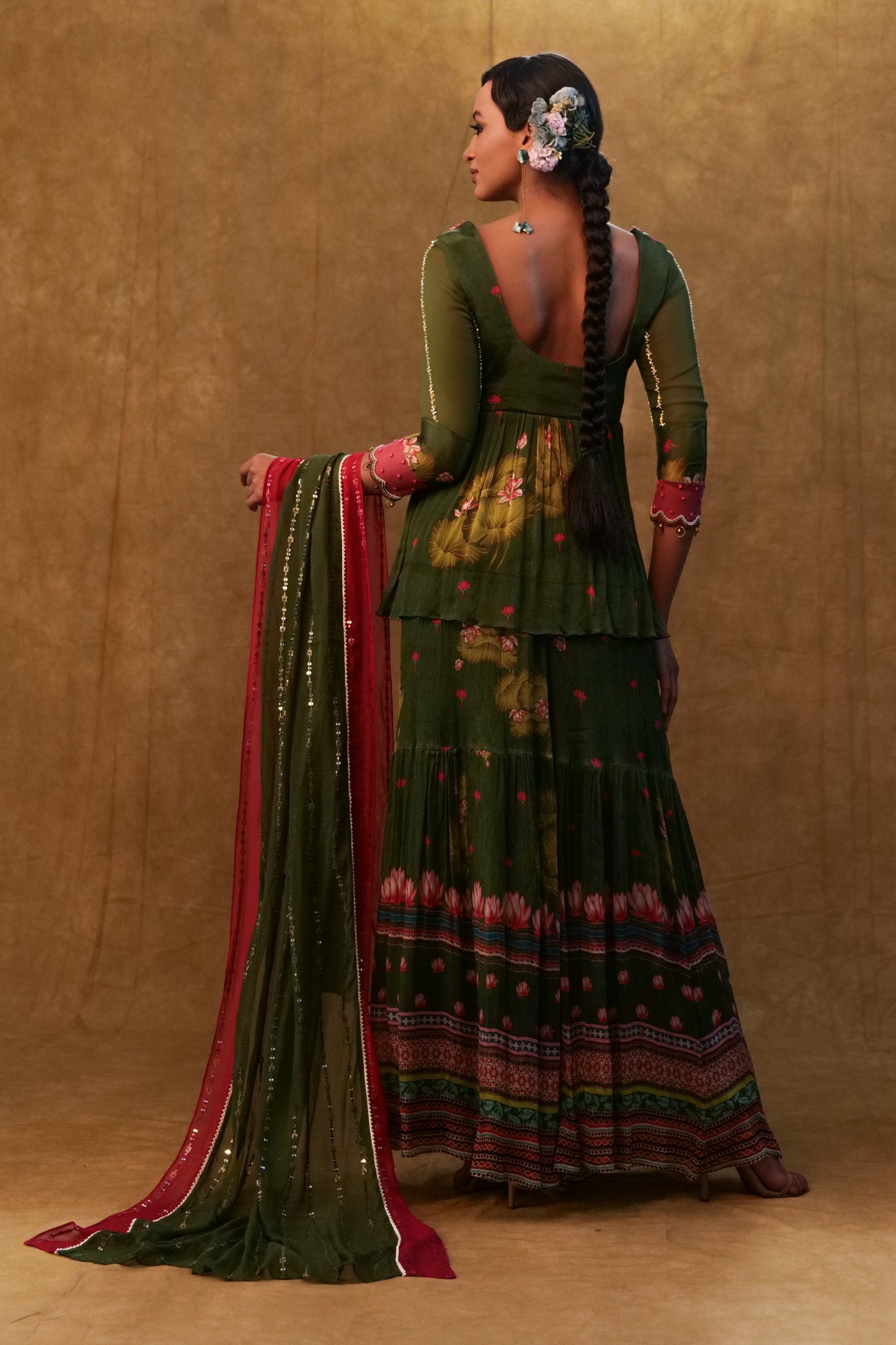 Green printed sharara set paired with color block dupatta and a peplum