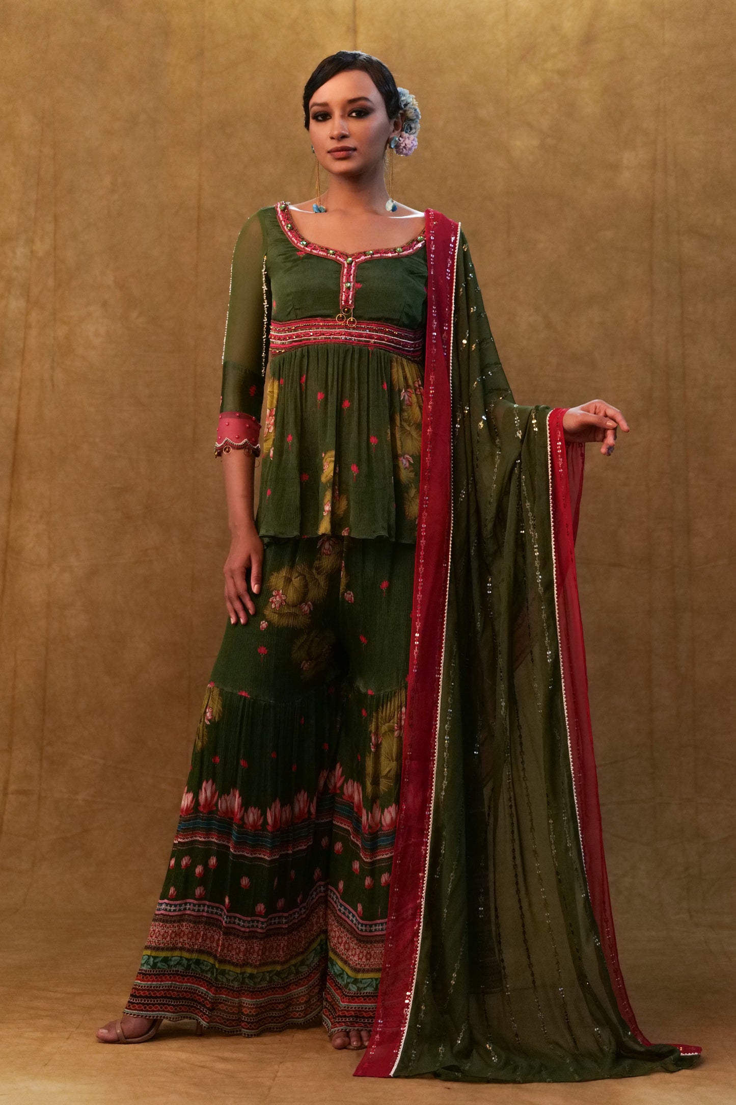 Green printed sharara set paired with color block dupatta and a peplum