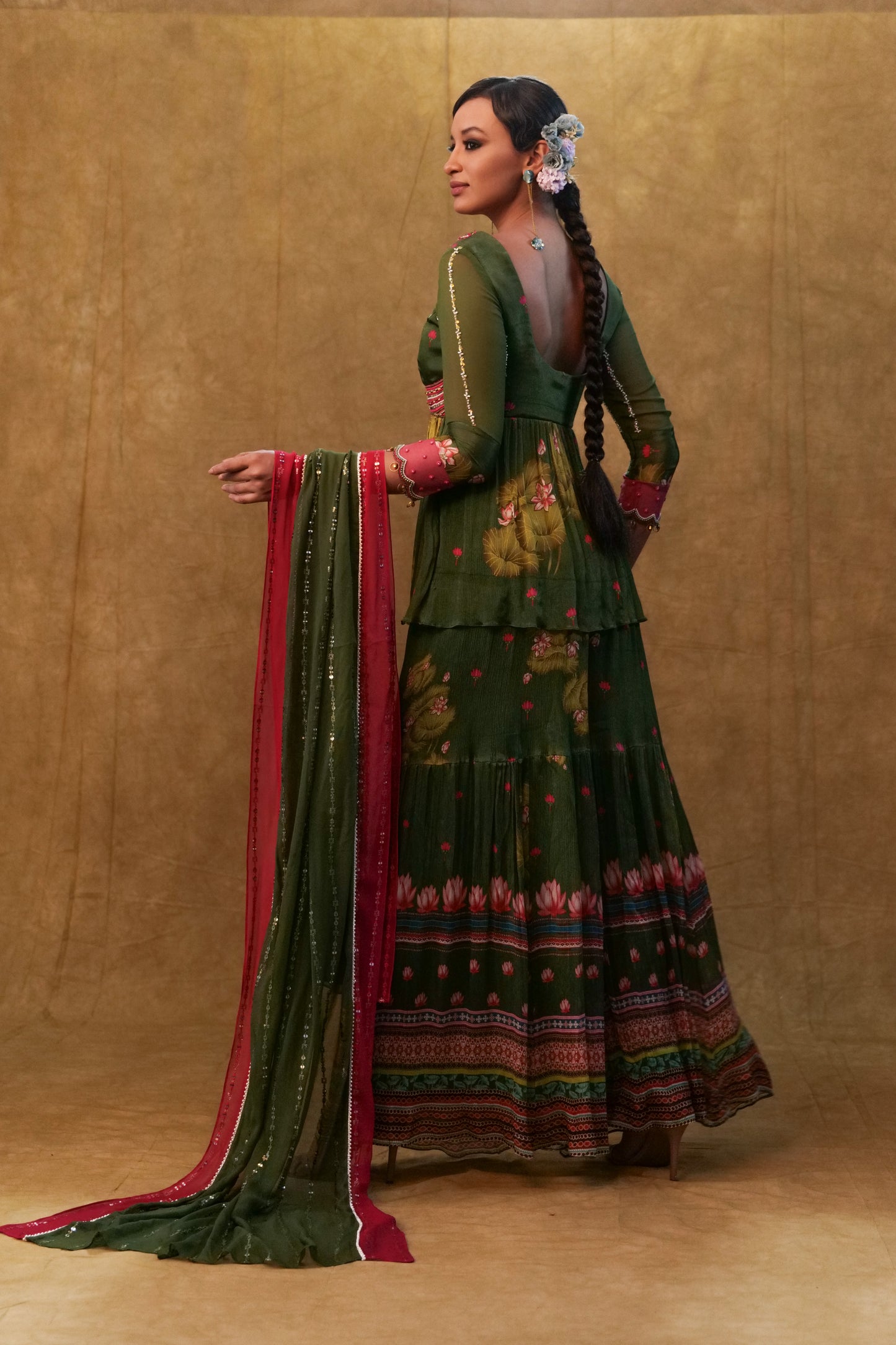Green printed sharara set paired with color block dupatta and a peplum