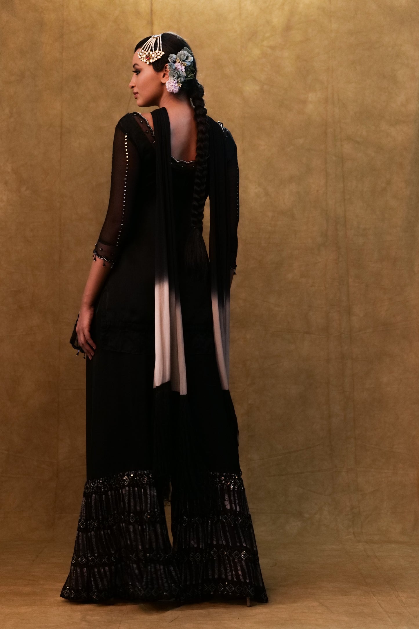 Black kurta set paired with fringe dupatta and flared pants