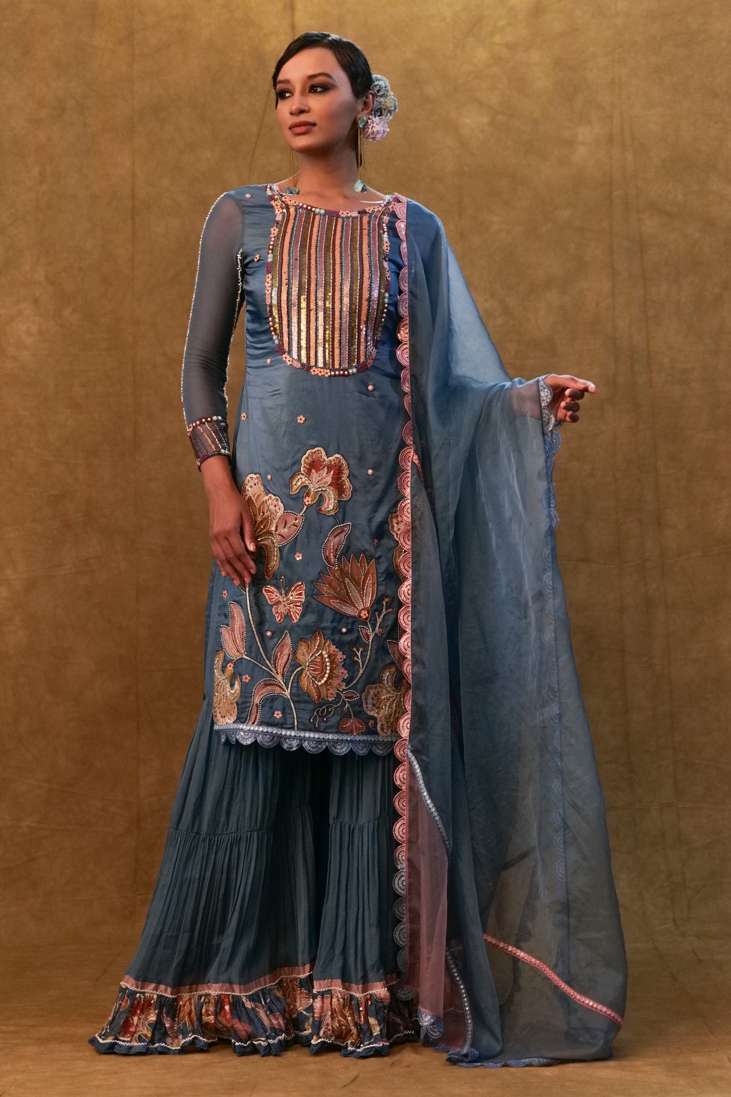 Blue applique work kurta set paired with flared sharara and a Dupatta