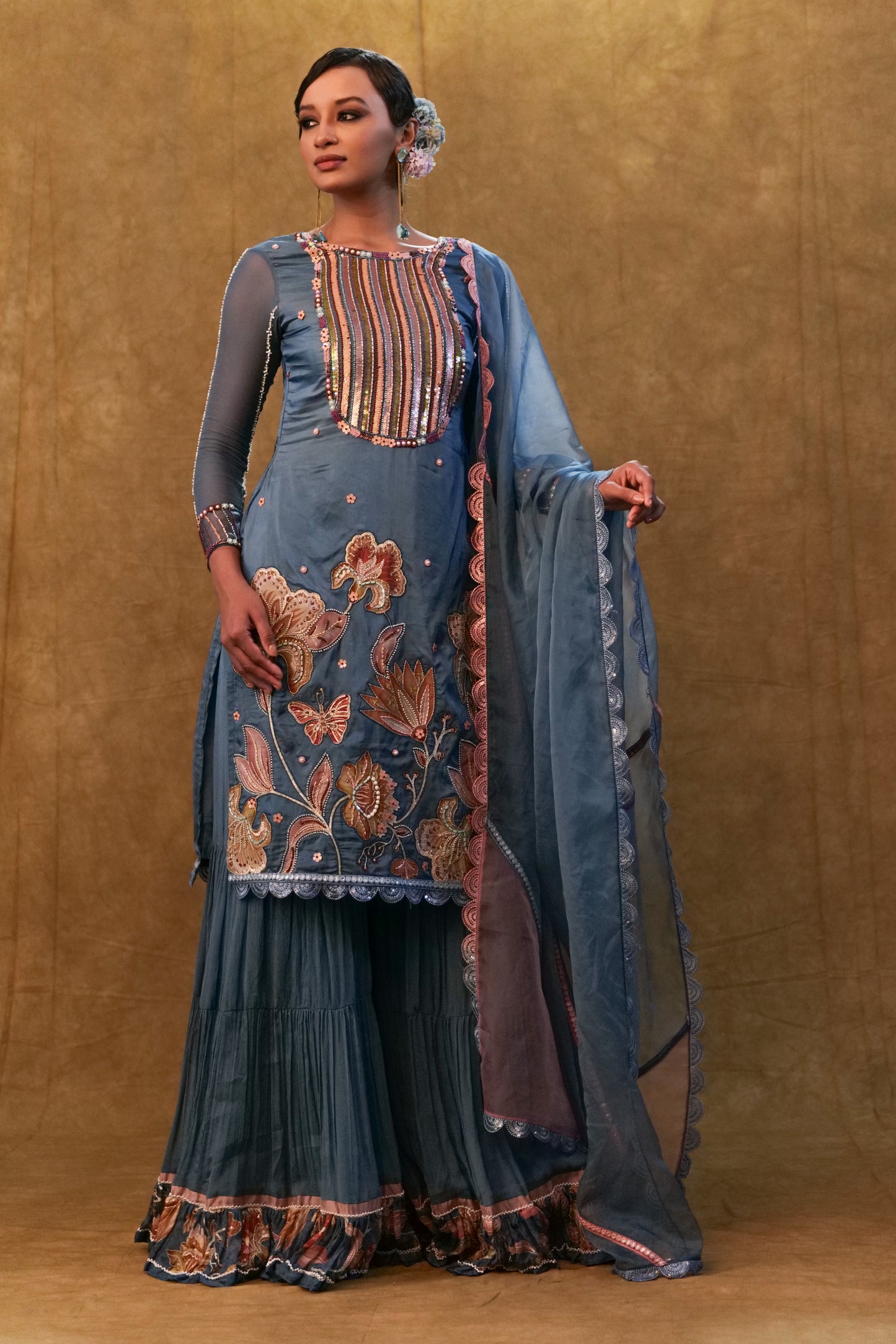 Blue applique work kurta set paired with flared sharara and a Dupatta