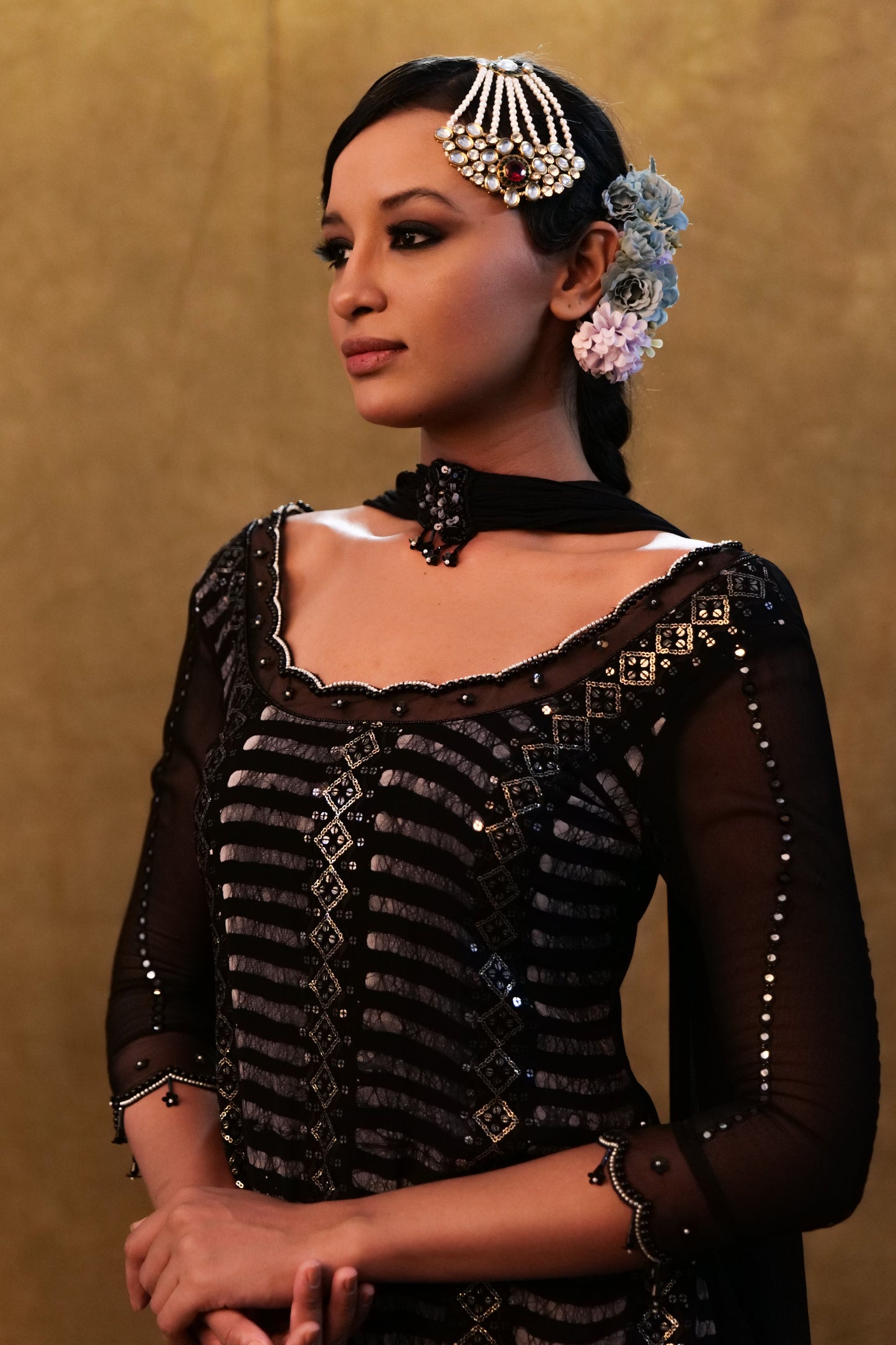 Black kurta set paired with fringe dupatta and flared pants