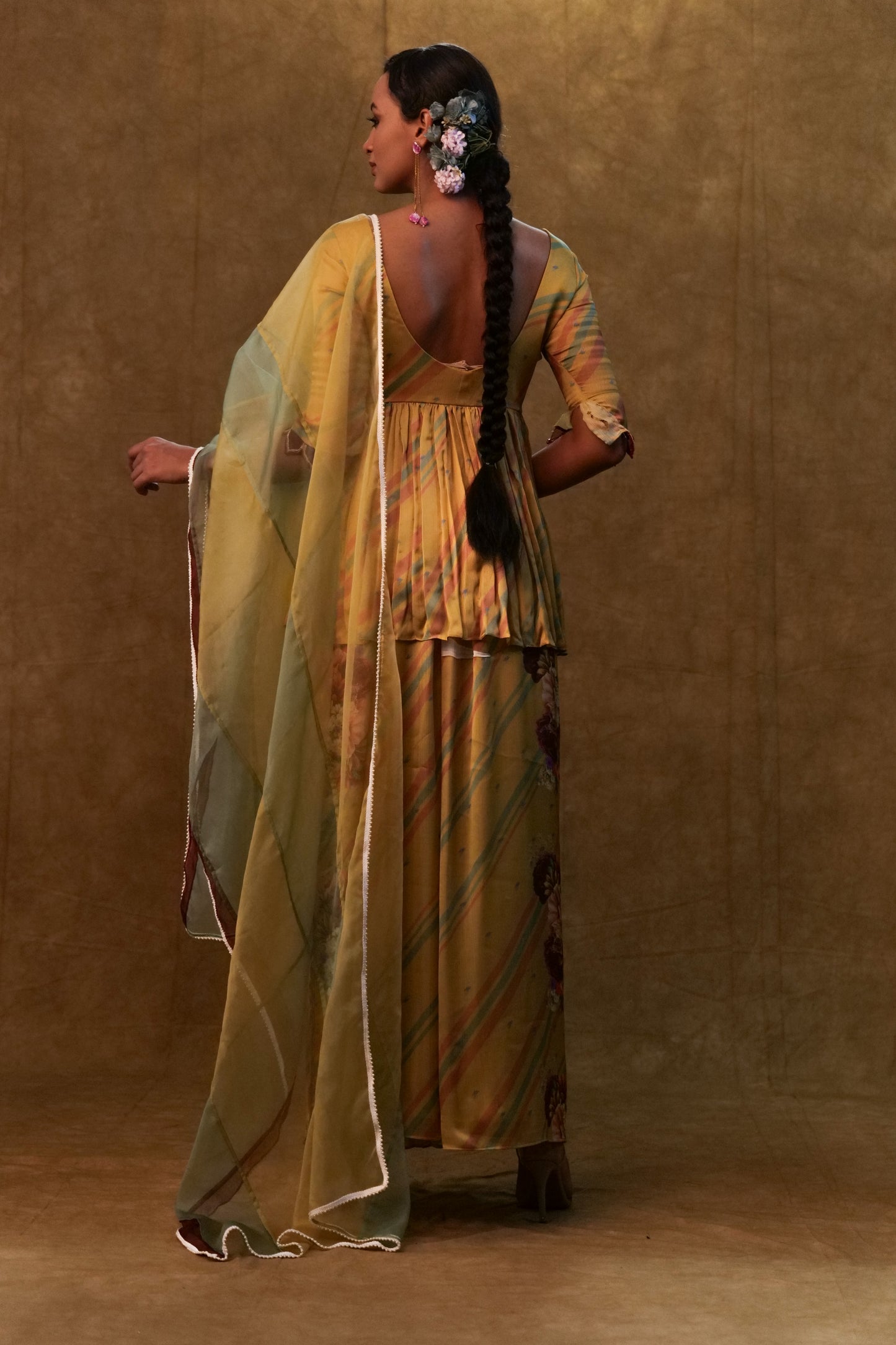 Mustard printed peplum set paired with dupatta and pants
