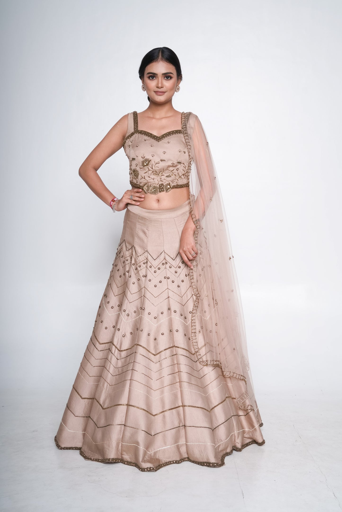 Gold lehenga set with spaghetti blouse