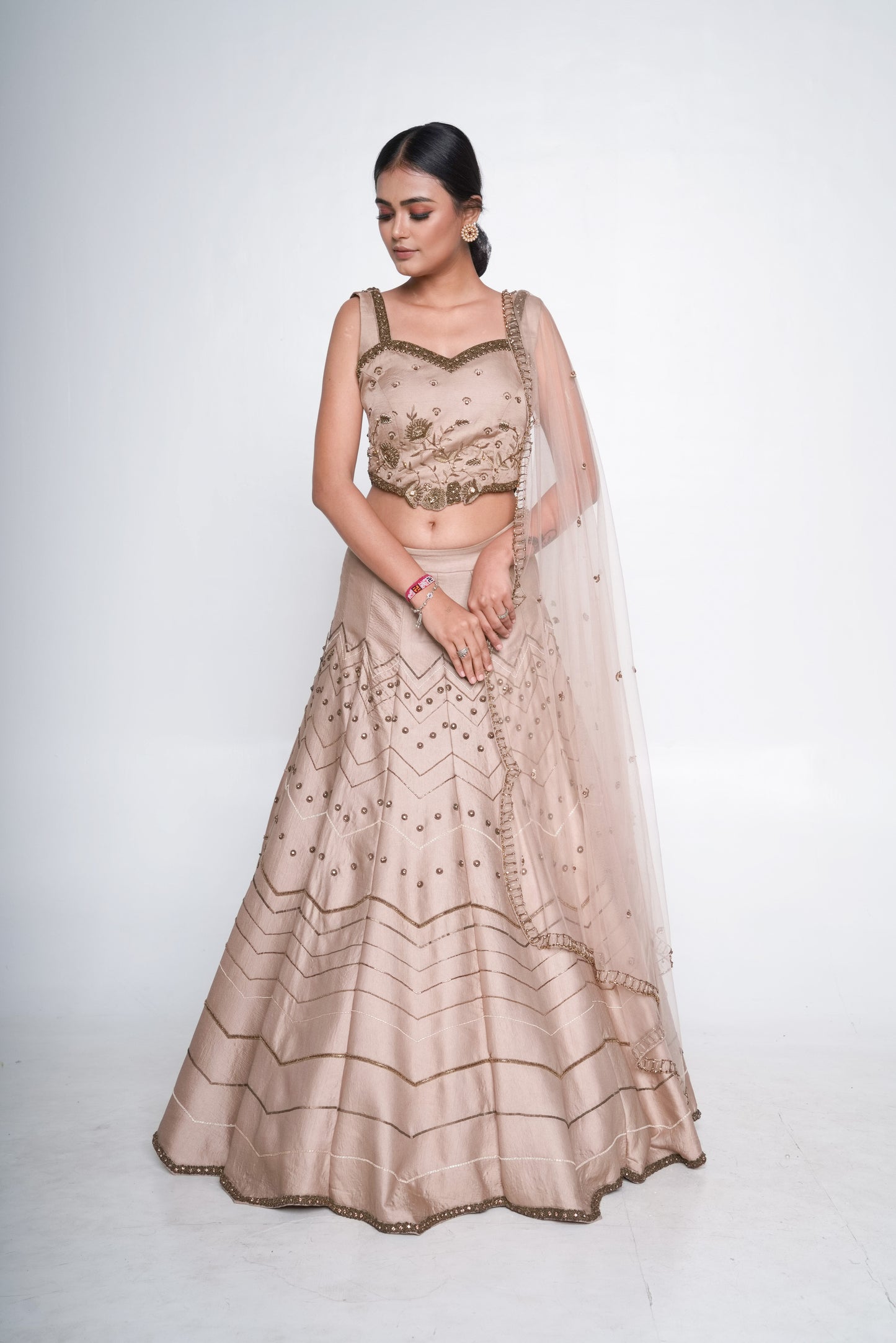 Gold lehenga set with spaghetti blouse