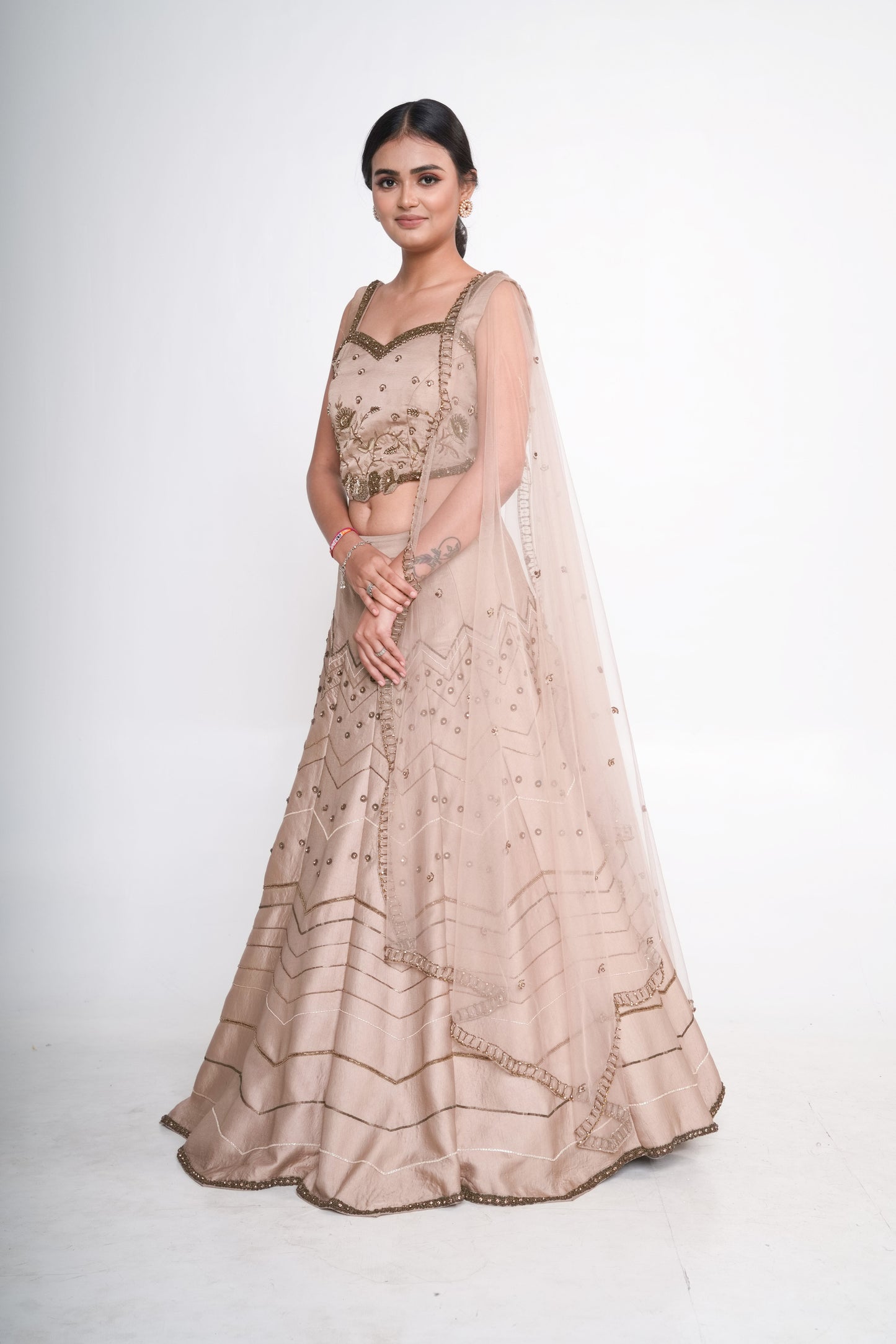 Gold lehenga set with spaghetti blouse