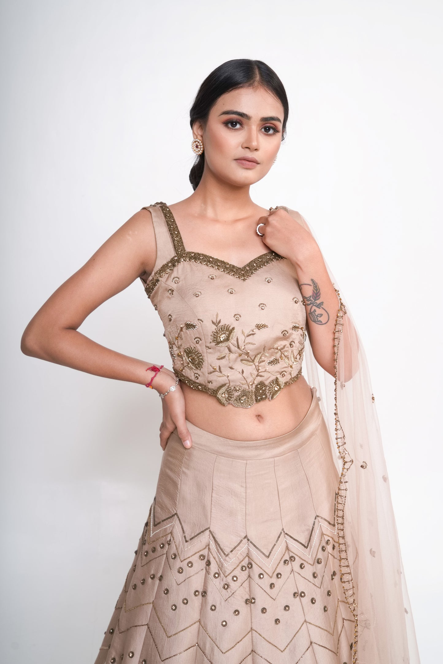 Gold lehenga set with spaghetti blouse