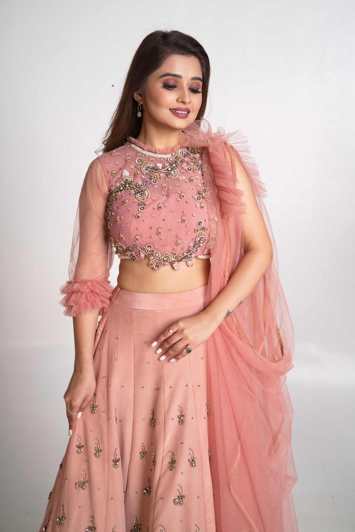 Pink layered lehenga set with pre drape net dupatta