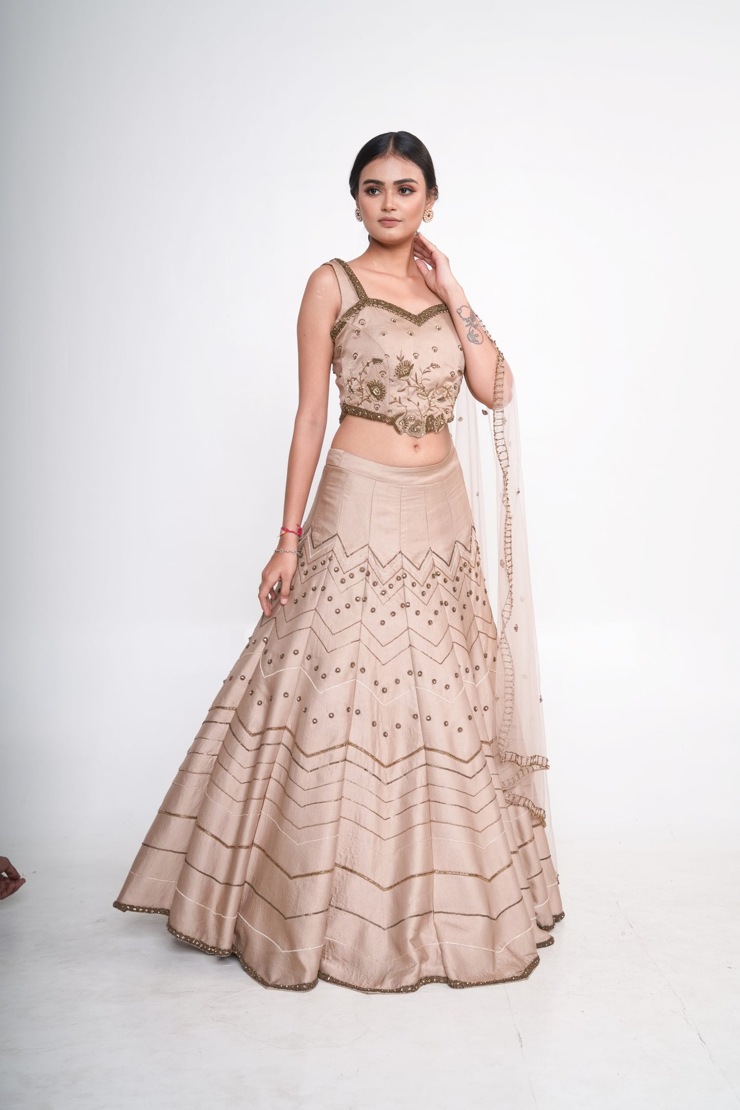 Gold lehenga set with spaghetti blouse