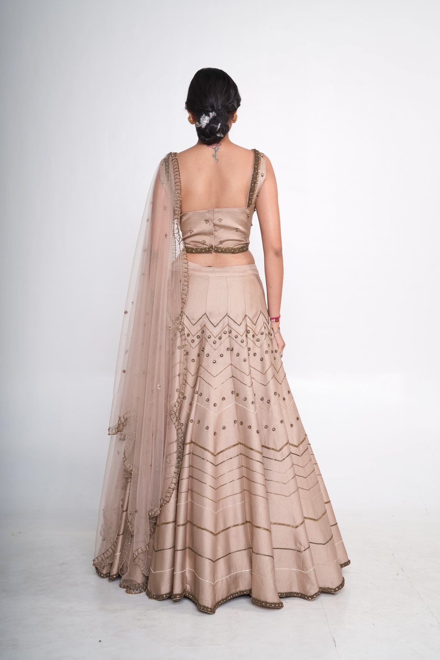 Gold lehenga set with spaghetti blouse