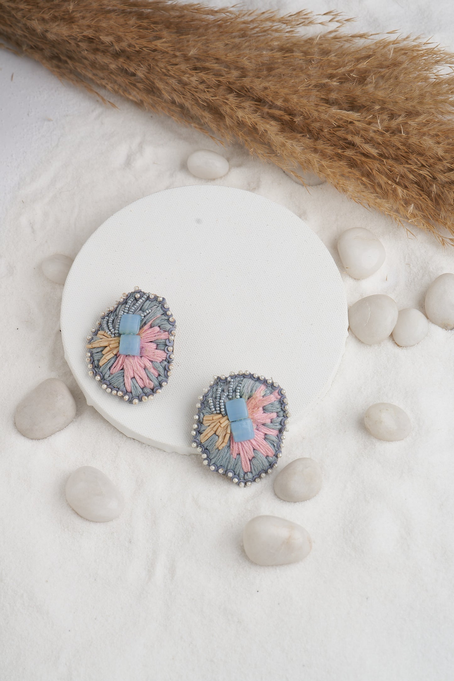 PAIR OF EARRINGS IN STONE