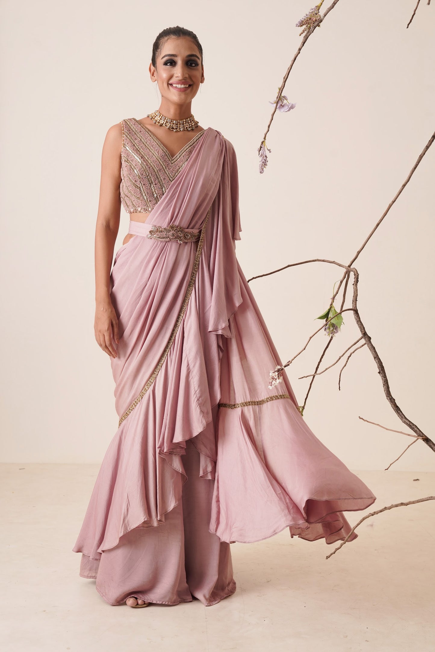 Ruffle saree with sequin embroidery blouse.