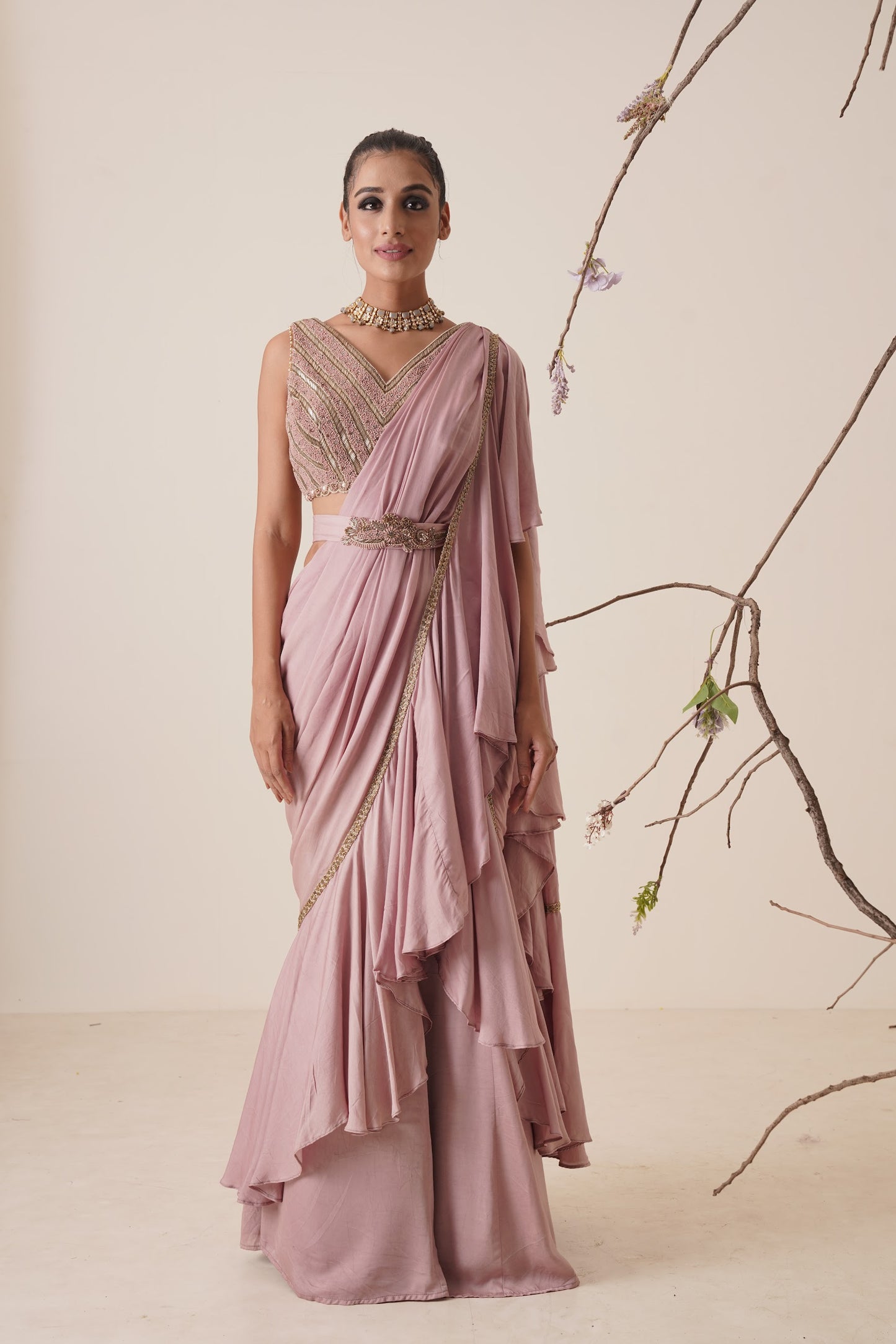 Ruffle saree with sequin embroidery blouse.
