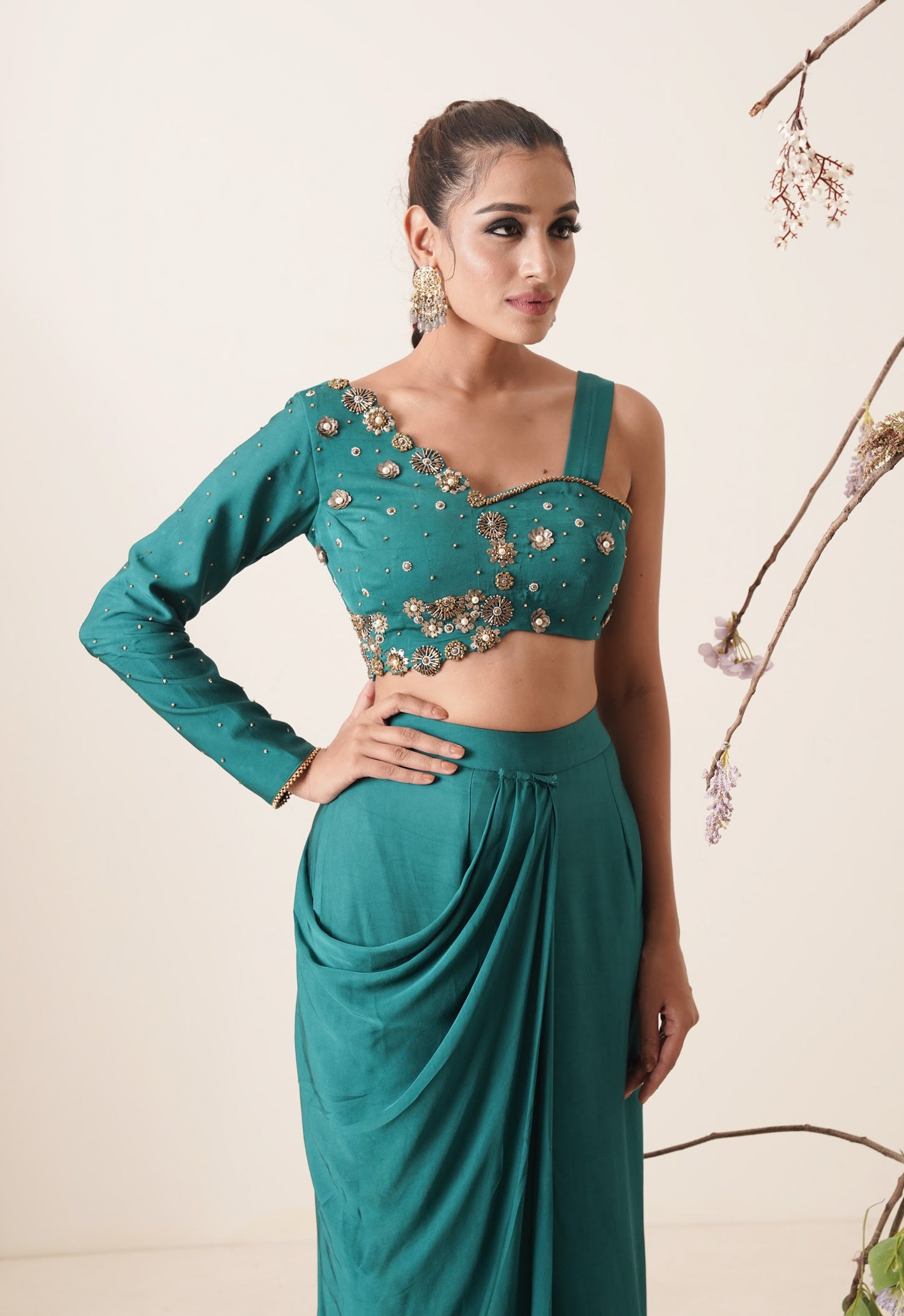 teal color pre-drape saree with waist belt and pallu comes in a full sleeve style.