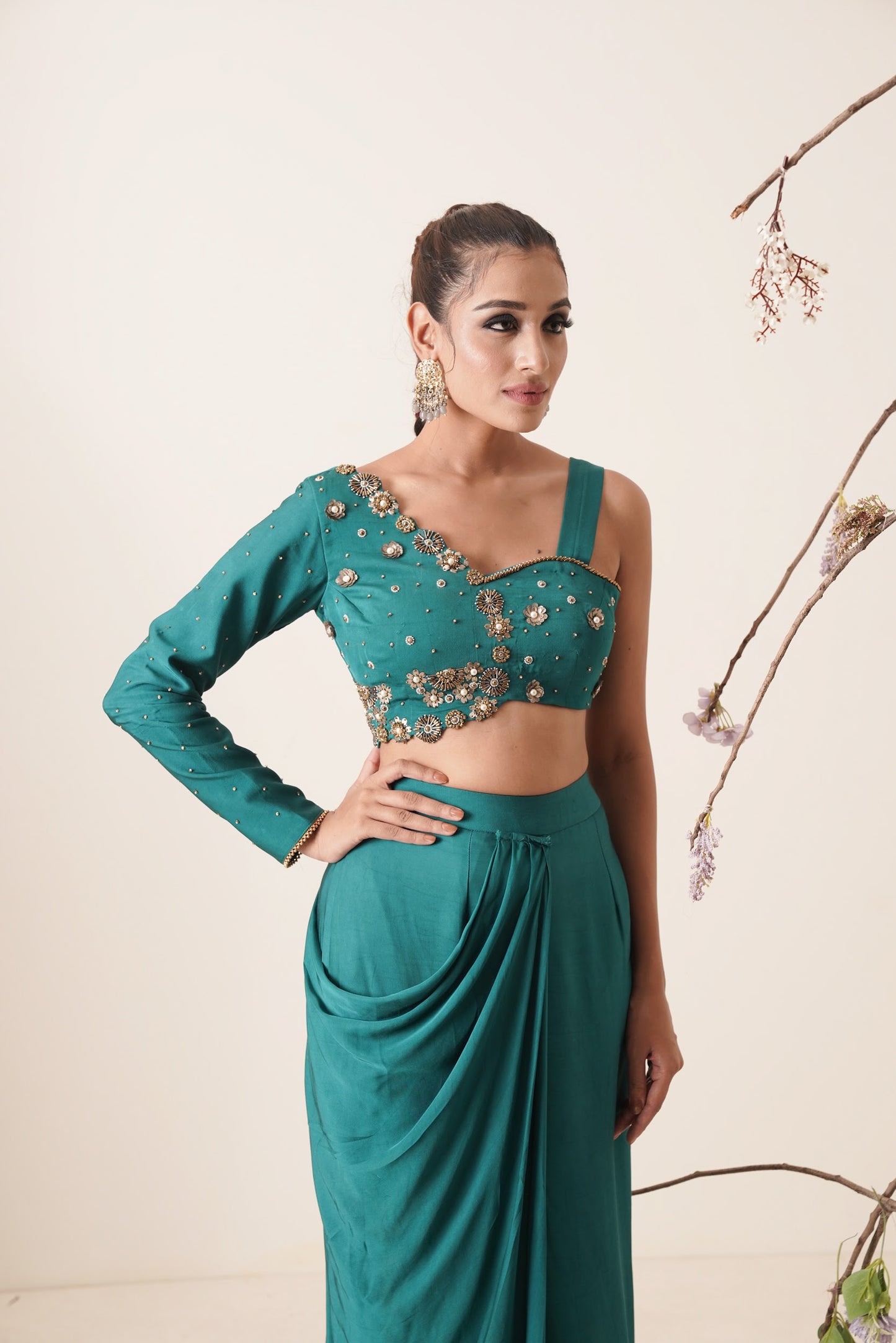 teal color pre-drape saree with waist belt and pallu comes in a full sleeve style.