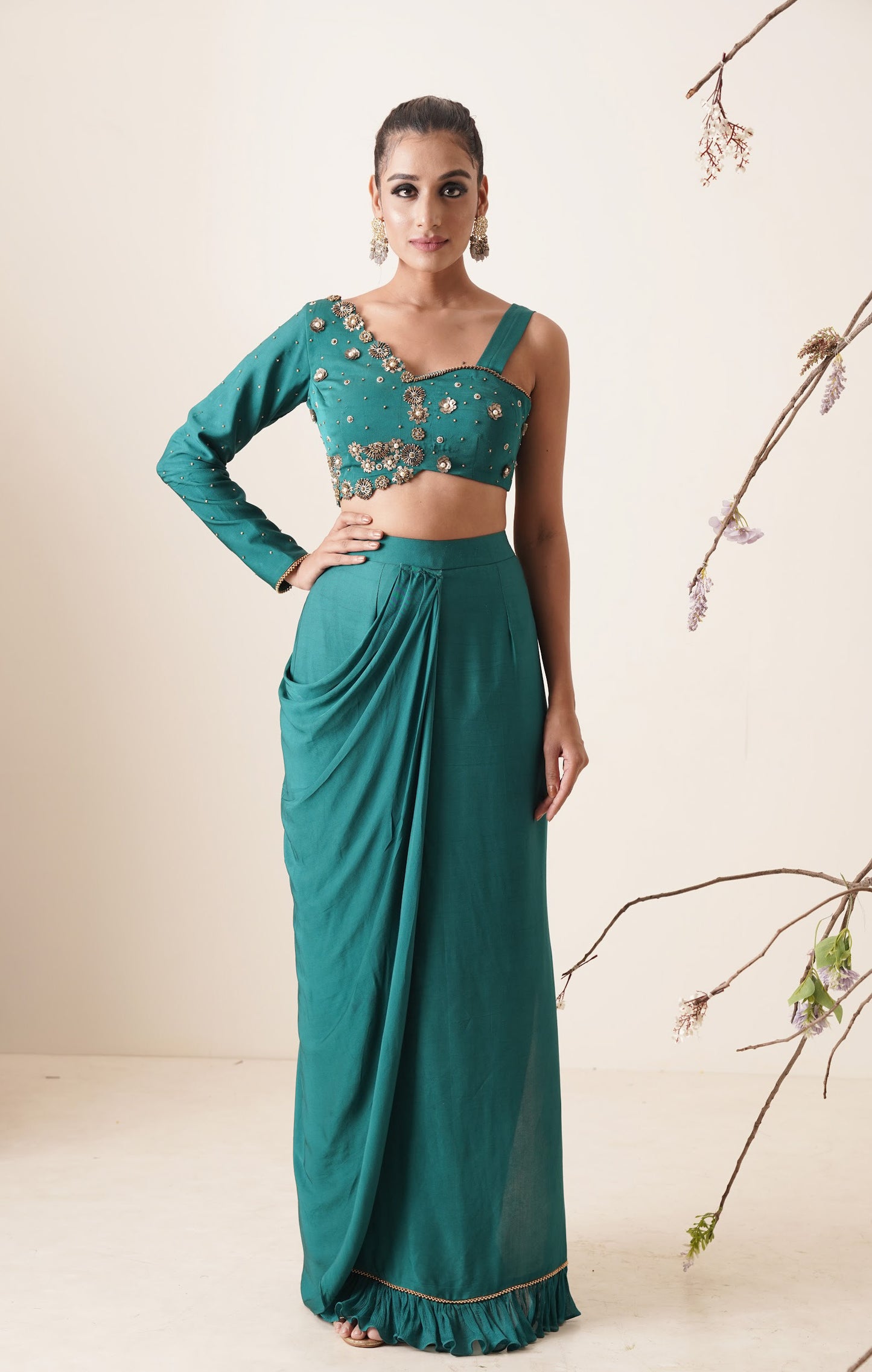 teal color pre-drape saree with waist belt and pallu comes in a full sleeve style.