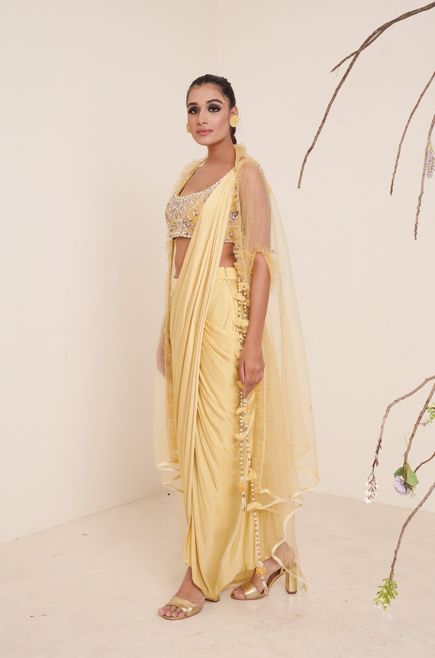 yellow pre-drape saree with shrug