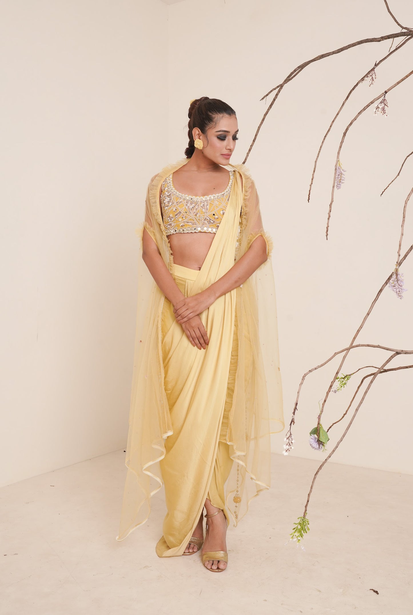 yellow pre-drape saree with shrug