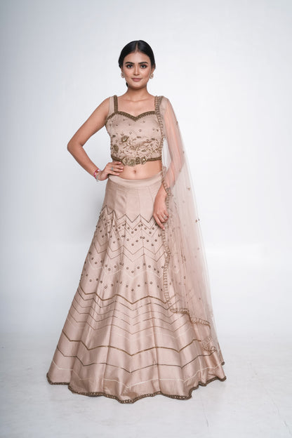Gold lehenga set with spaghetti blouse