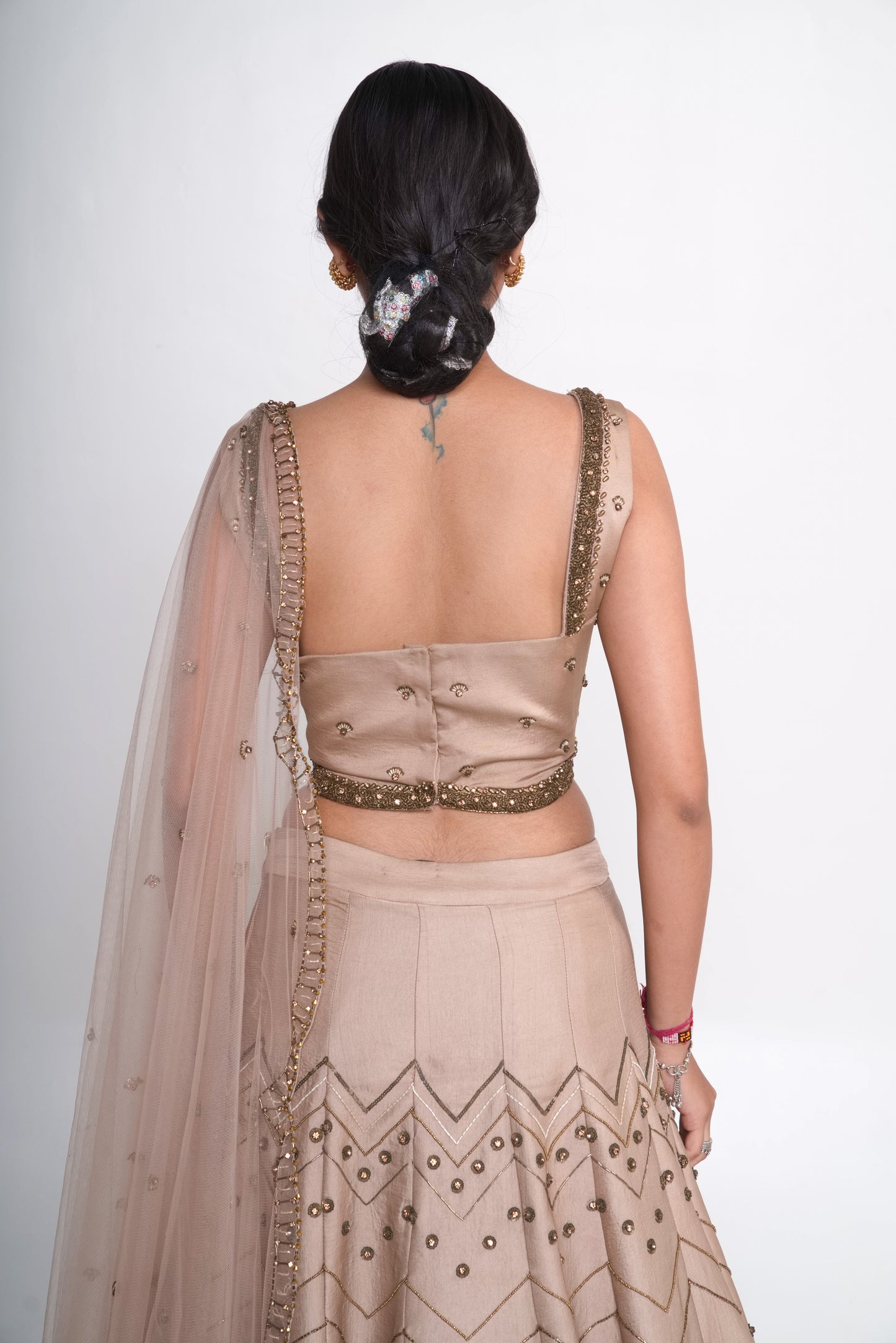 Gold lehenga set with spaghetti blouse
