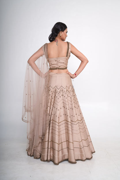 Gold lehenga set with spaghetti blouse
