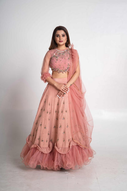 Pink layered lehenga set with pre drape net dupatta